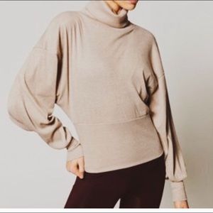 Free People bubble sleeve sweater with shimmer.